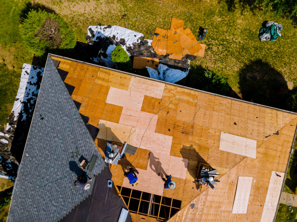 burtonsville roofers installing a new roof on a home.